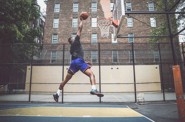 Basketball player training on a court in New york city