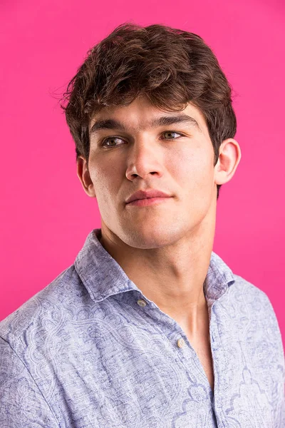 Portrait of young handsome man in a photographic studio