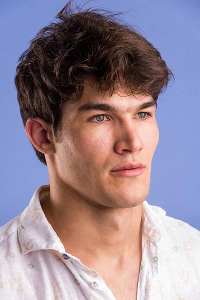 Portrait of young handsome man in a photographic studio