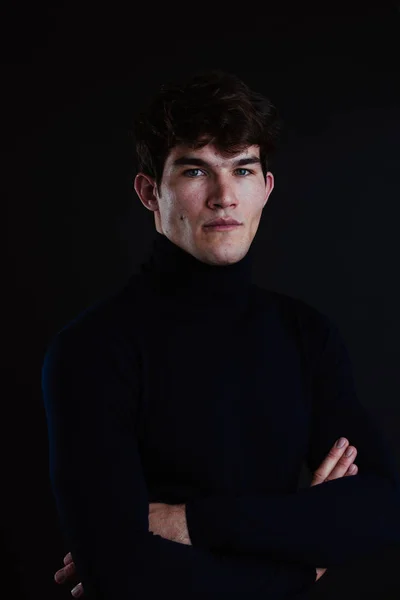Portrait of young handsome man in a photographic studio