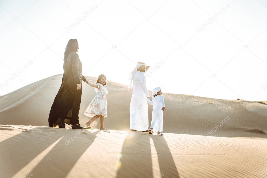 Happy family spending a wonderful day in the desert