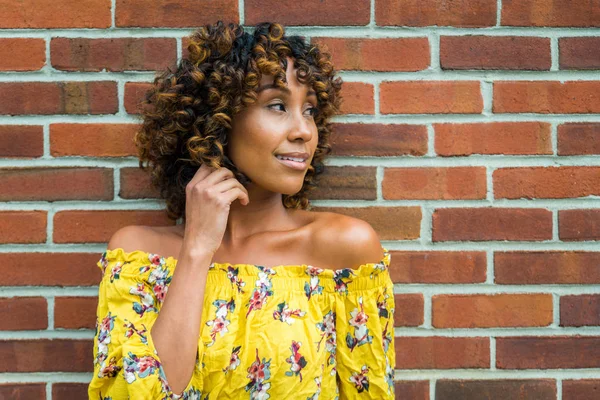 Happy african american woman smiling. Beautiful young femal walking and having fun in New York city