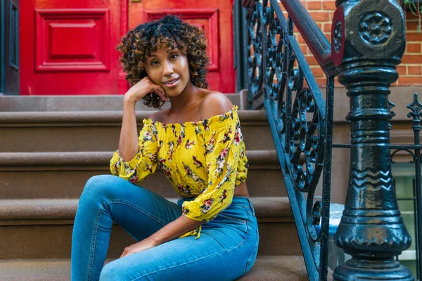 Happy african american woman smiling. Beautiful young femal walking and having fun in New York city