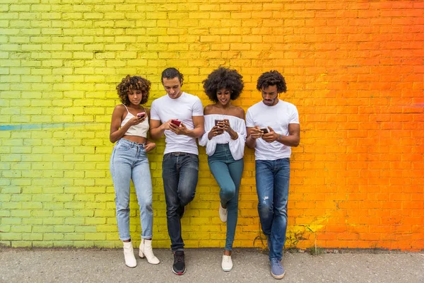 Group of afroamerican friends bonding in Manhattan, New York - Young adults having fun outdoors, concepts about lifestyle and young adult generation