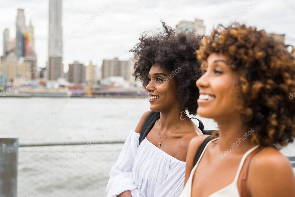 Group of afroamerican friends bonding in Manhattan, New York - Young adults having fun outdoors, concepts about lifestyle and young adult generation