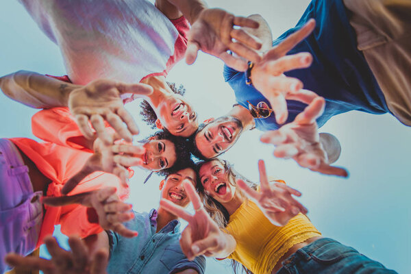 Young happy people having a barbecue dinner on a rooftop in New York - Group of friends having party and having fun