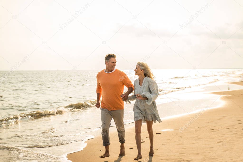 Beautiful happy senior couple dating outdoors - Youthful married couple having fun and enjoying life together