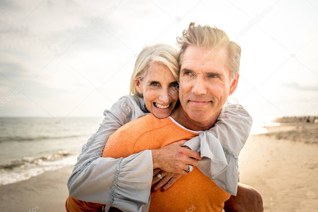 Beautiful happy senior couple dating outdoors - Youthful married couple having fun and enjoying life together