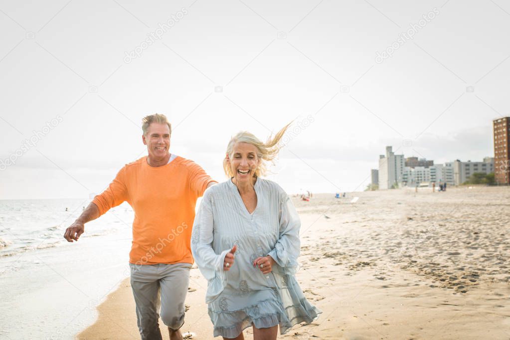 Beautiful happy senior couple dating outdoors - Youthful married couple having fun and enjoying life together