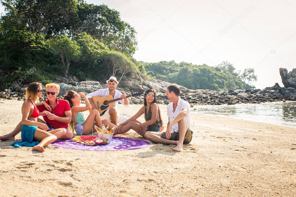 Group of happy friends on a tropical island