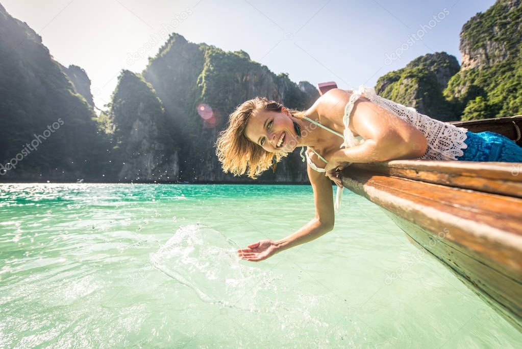 Beautiful woman on a long-tail boat in Thailand