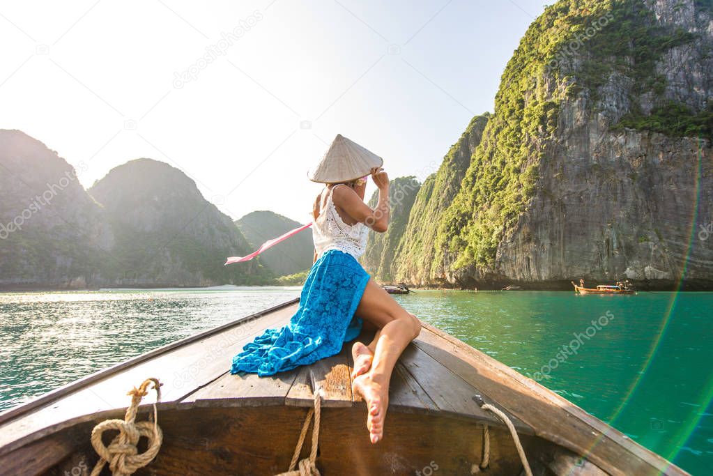 Beautiful woman on a long-tail boat in Thailand