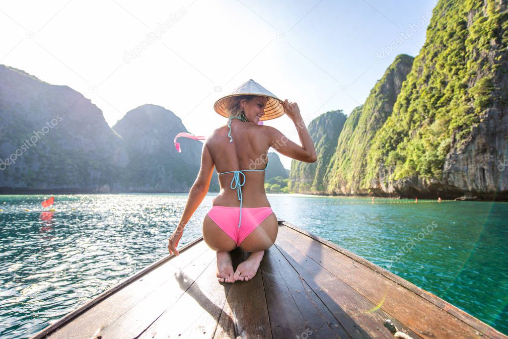 Beautiful woman on a long-tail boat in Thailand