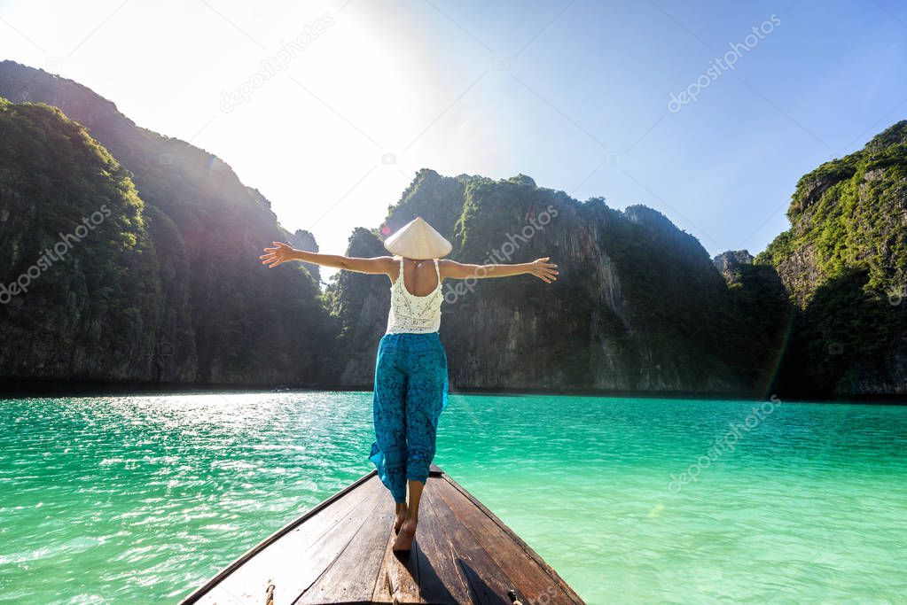 Beautiful woman on a long-tail boat in Thailand