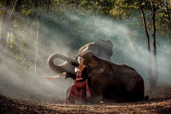 Elephant and woman in Thailand