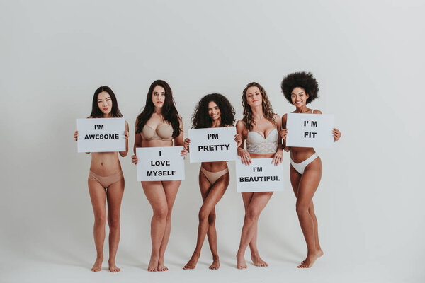 Group of women with different body and ethnicity posing together