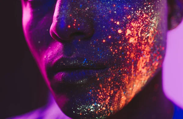 Handsome boy dancing at the rave party with fluorescent painting — Stock Photo, Image