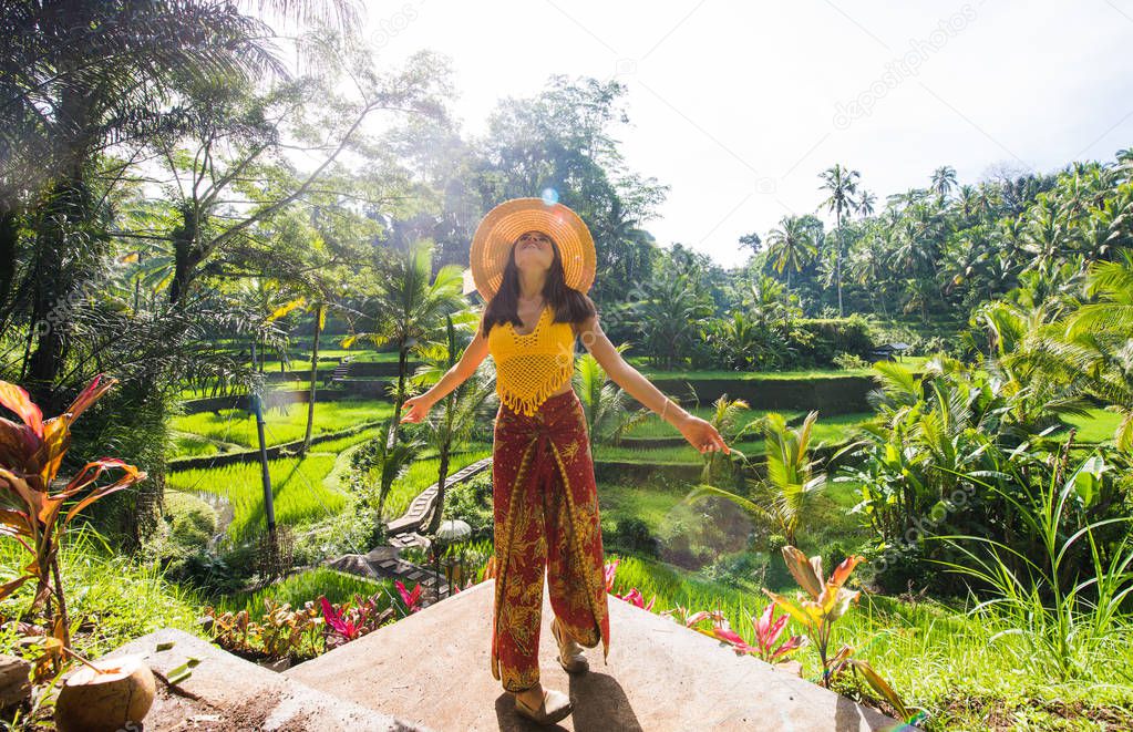 Beautiful girl visiting the Bali rice fields in tegalalang, ubud