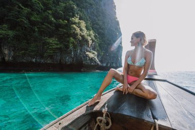 Beautiful woman making an excursion to phi phi island and maya b clipart