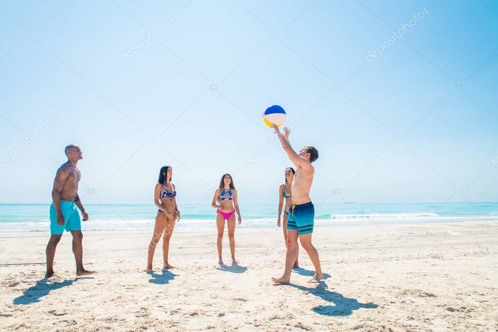 Friends having fun on the beach