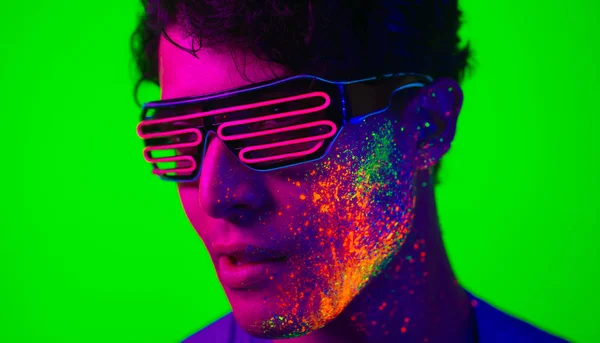 Fashion model with fluo painting on the face — Stock Photo, Image