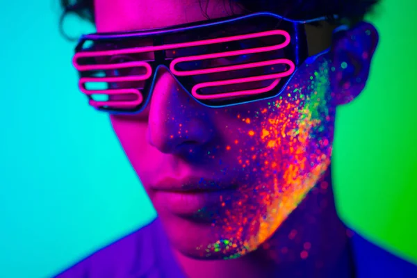 Fashion model with fluo painting on the face — Stock Photo, Image