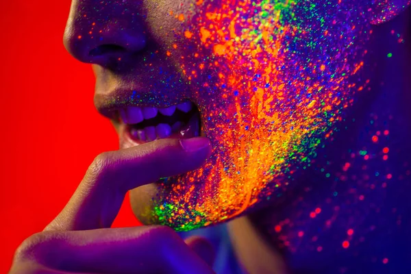 Fashion model with fluo painting on the face — Stock Photo, Image