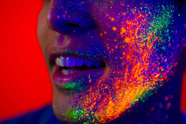 Fashion model with fluo painting on the face — Stock Photo, Image