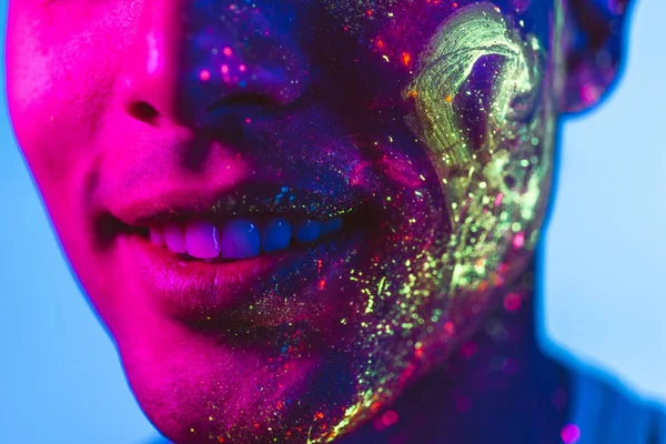 Fashion model with fluo painting on the face — Stock Photo, Image