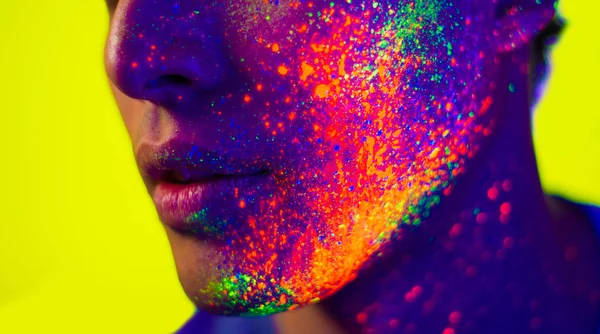 Fashion model with fluo painting on the face — Stock Photo, Image