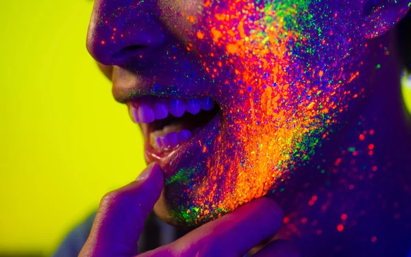 Fashion model with fluo painting on the face — Stock Photo, Image