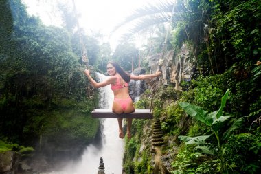Pretty girl at Tegenungan Waterfall, Bali clipart