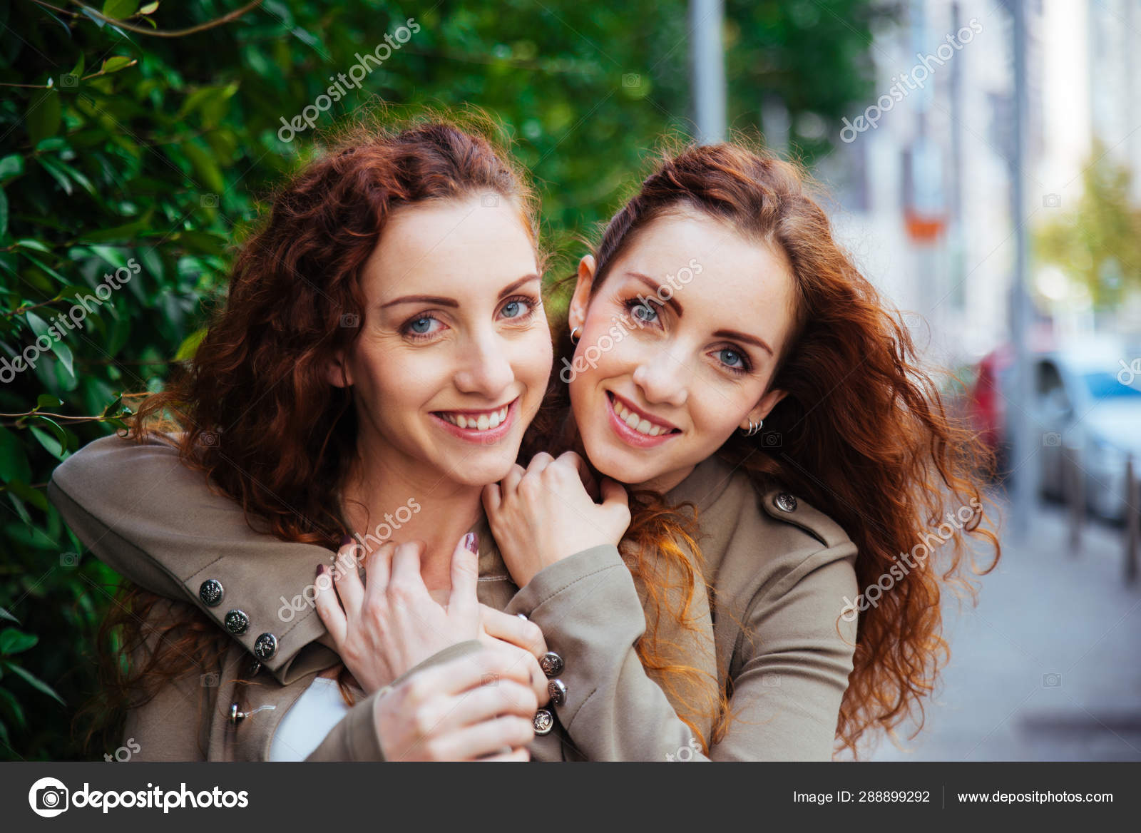 Twin sisters bonding outdoors — Stock Photo © oneinchpunch #288899292