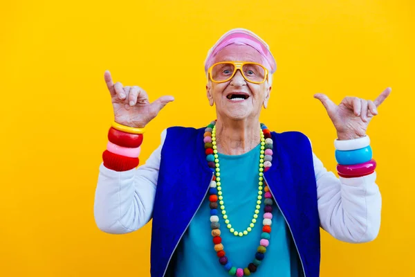 Funny grandmother portraits. 80s style outfit. trapstar dance on — Stock Photo, Image