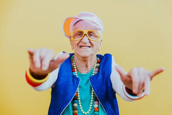 Funny grandmother portraits. 80s style outfit. trapstar dance on — Stock Photo, Image