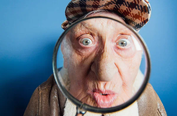 Funny portraits with old grandmother. Senior woman acting as an — Stock Photo, Image