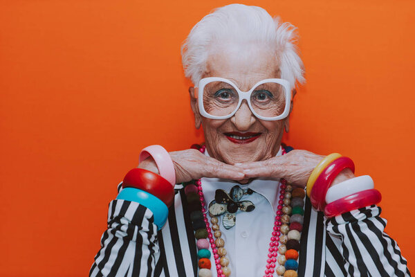 Funny grandmother portraits. Senior old woman dressing elegant f