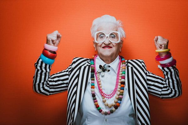 Funny grandmother portraits. Senior old woman dressing elegant f