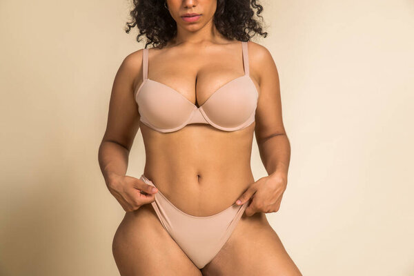 Pretty oversize woman posing in studio - Beautiful girl accepting her body imperfection, beauty shot in studio - Concepts about body acceptance, body positivity and diversity