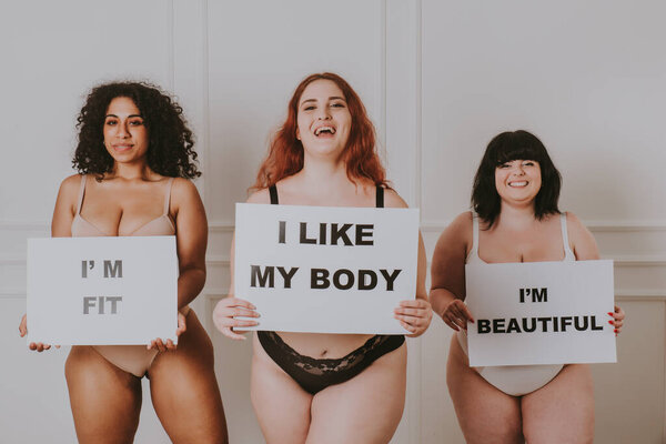 Group of 3 oversize women posing in studio - Beautiful girls accepting body imperfection, beauty shots in studio - Concepts about body acceptance, body positivity and diversity