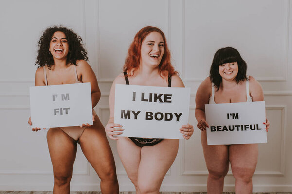 Group of 3 oversize women posing in studio - Beautiful girls accepting body imperfection, beauty shots in studio - Concepts about body acceptance, body positivity and diversity