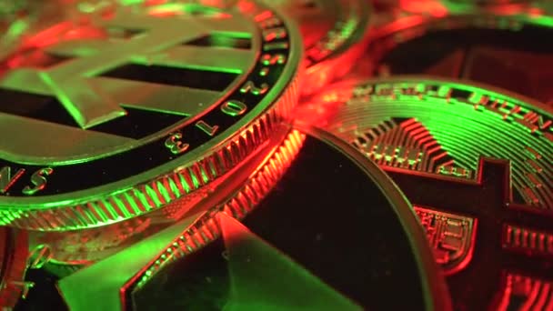 Macro shot of crypto money super close up, Litecoin with Bitcoin and Etherium light with green and red light. Mining time. Cryptocurrencys new digital money, Bitcoin, litecoin, etherium coins — Stock Video