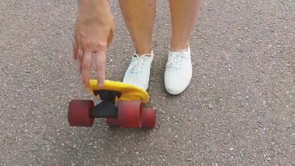 Teenage Girl Putting Short Modern Skateboard — Stock Video