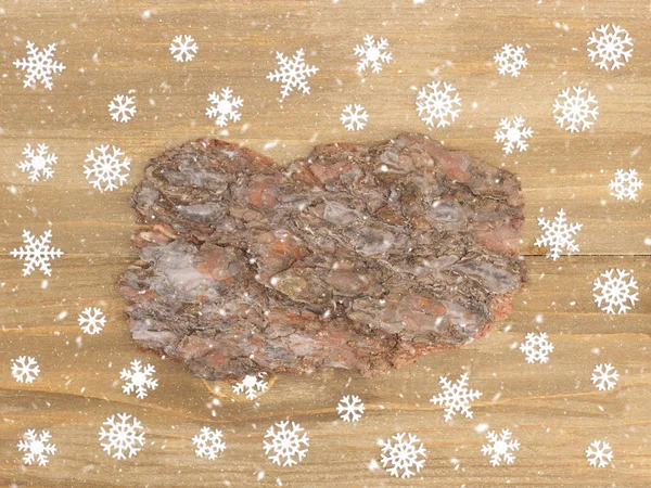 Brown wooden Christmas background with snowflakes and bark. Chri — ストック写真