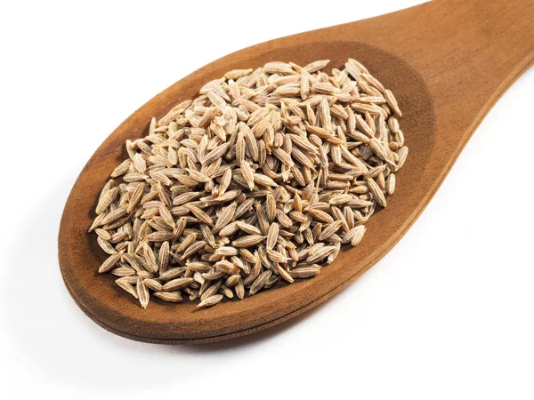 Cumin seeds (Cuminum), Jeera in wooden spoon on a white backgrou — Stock Photo, Image