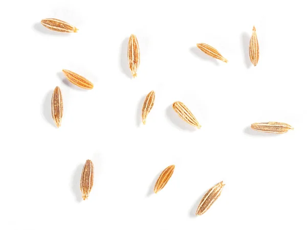 Cumin seeds (Cuminum), jeera on a white background. Macro photo — Stock Photo, Image