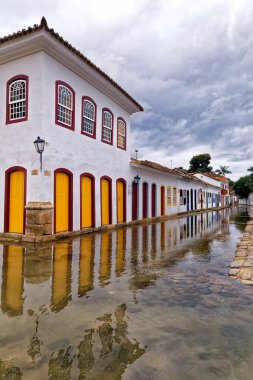 Overview of cobbled street flooded with old houses in Paraty, a historic city fully preserved on the coast of the state of Rio de Janeiro, southwest Brazil clipart