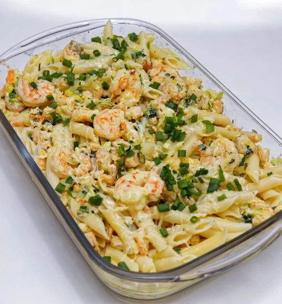 Penne pasta with shrimp sauce served on the platter