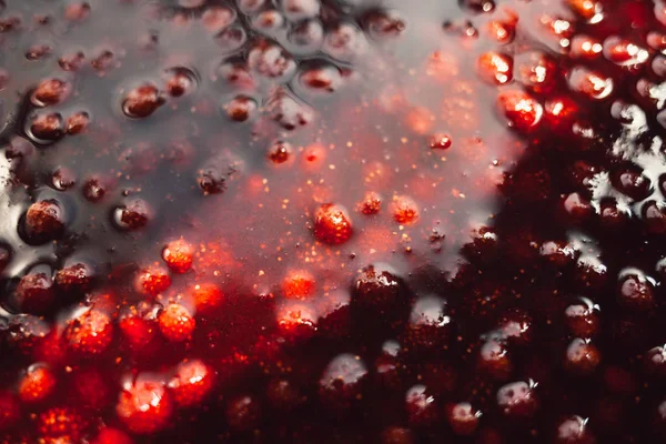 sun glare strawberry jam texture close up