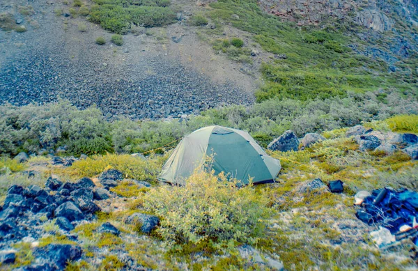 Tent pitched near a small river in the Wrangell-St. Elias Nation